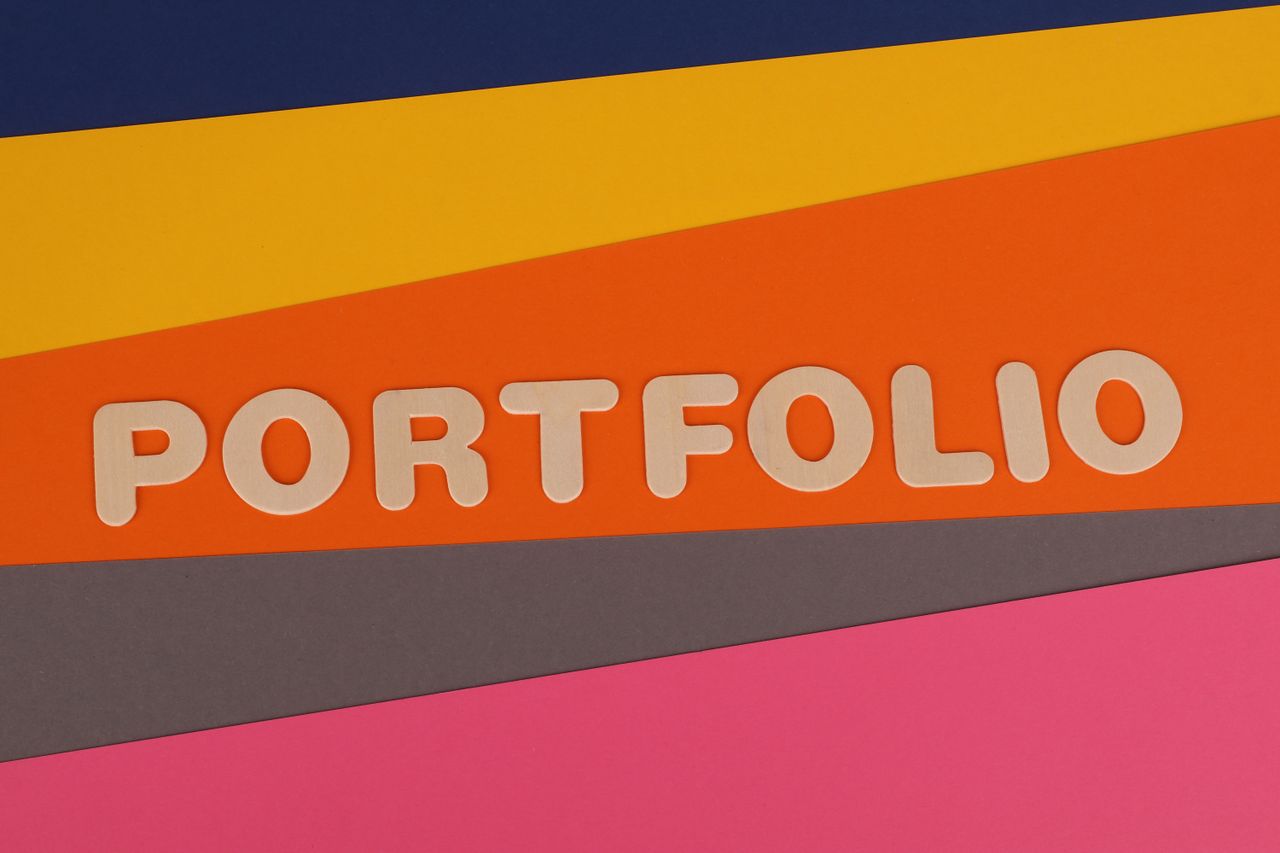 why-choose-us A vibrant multicolored background featuring the text PORTFOLIO in pink font on colorful paper.